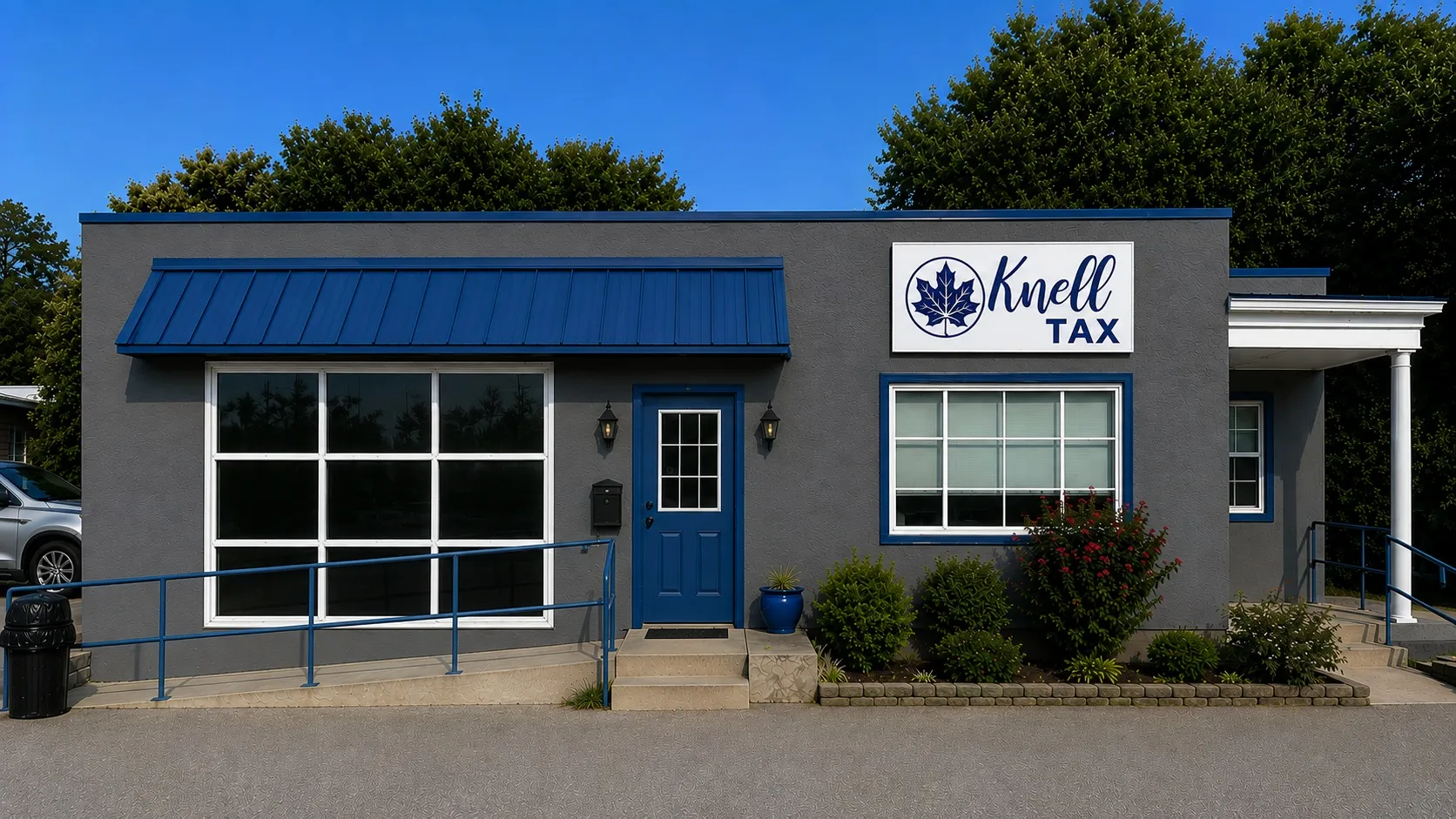 Concept rendering of the finished Knell building painted charcoal gray with blue trim, blue awning and a Knell Tax sign