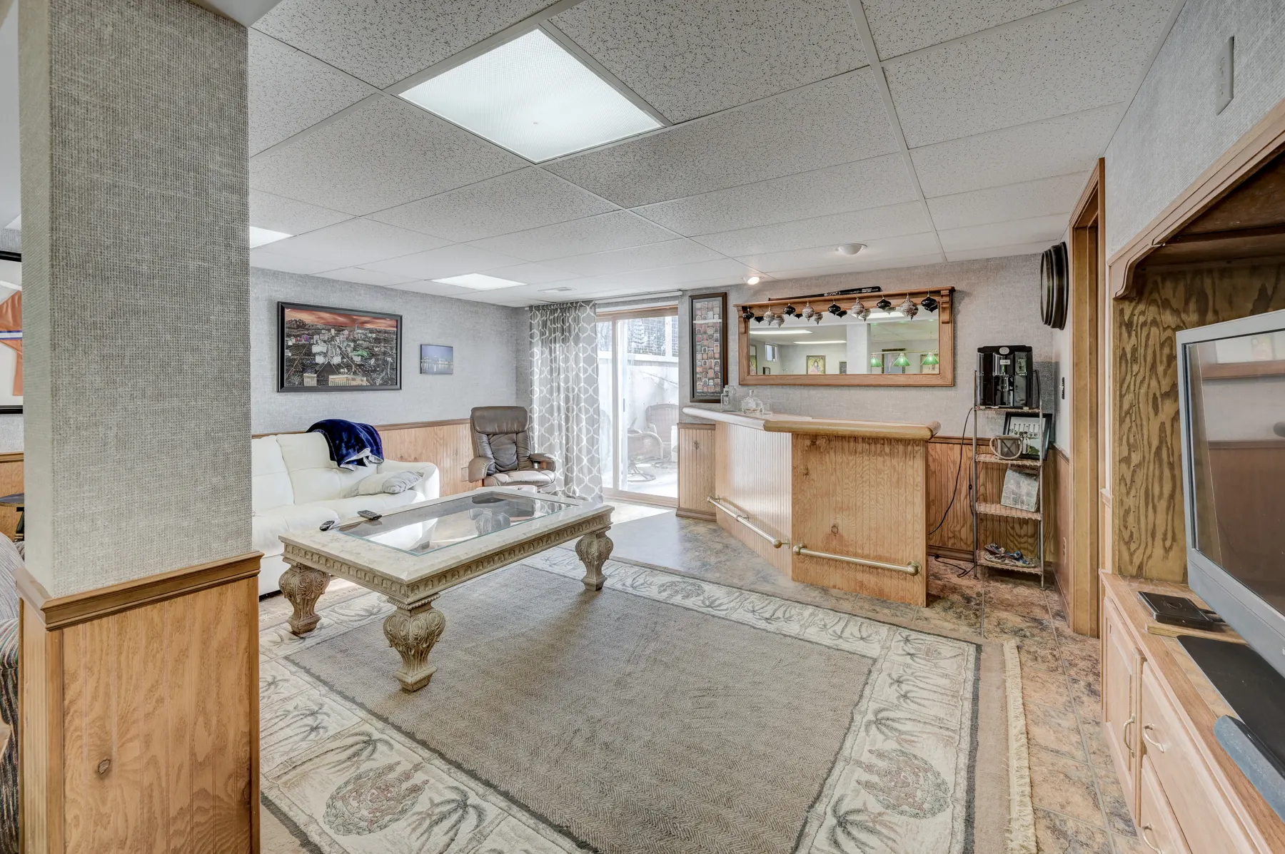 Finished basement with wood trim and a seating area