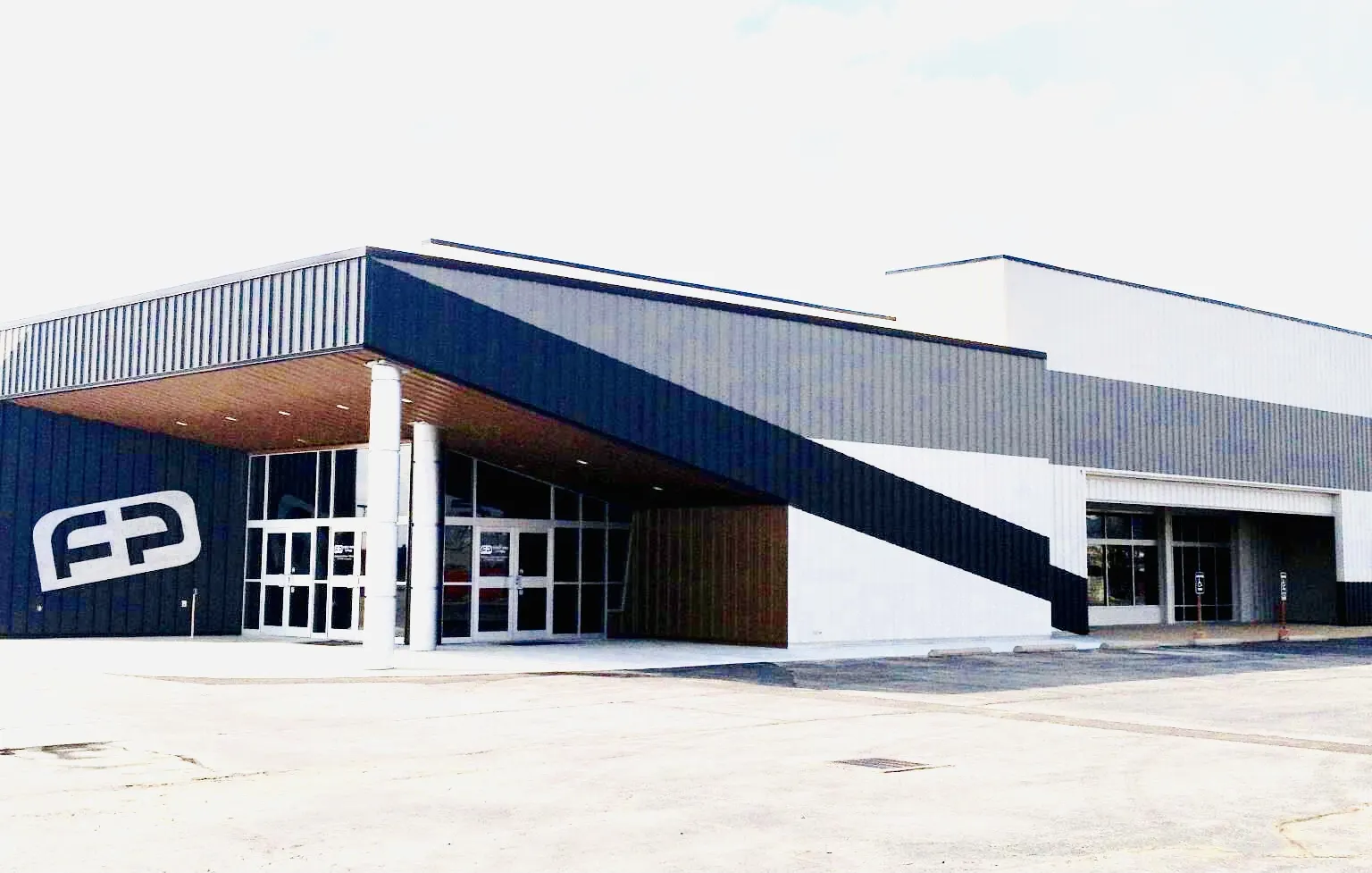 Commercial building with a new angled metal canopy entrance