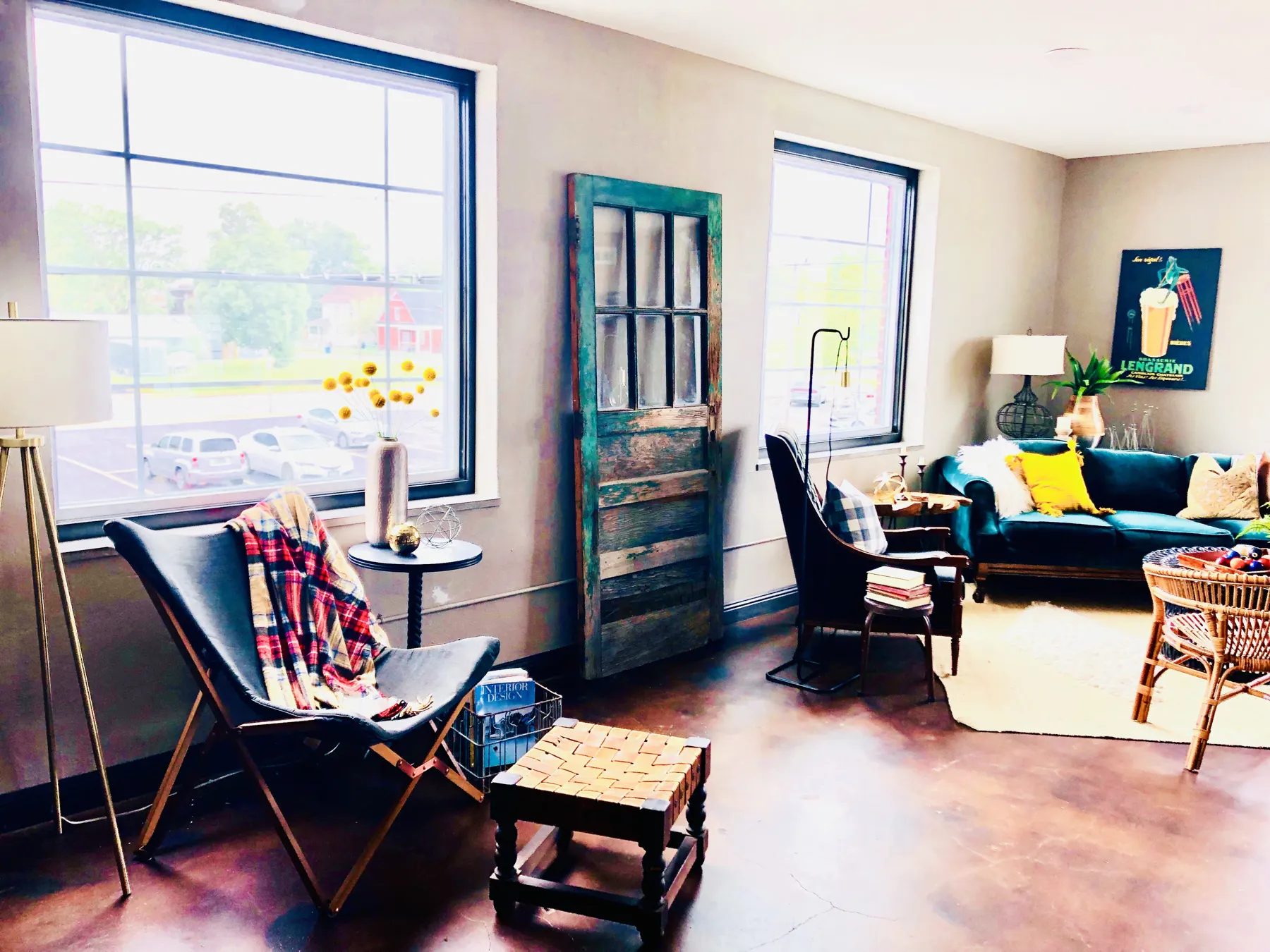 Loft living room with large windows and stained concrete floors