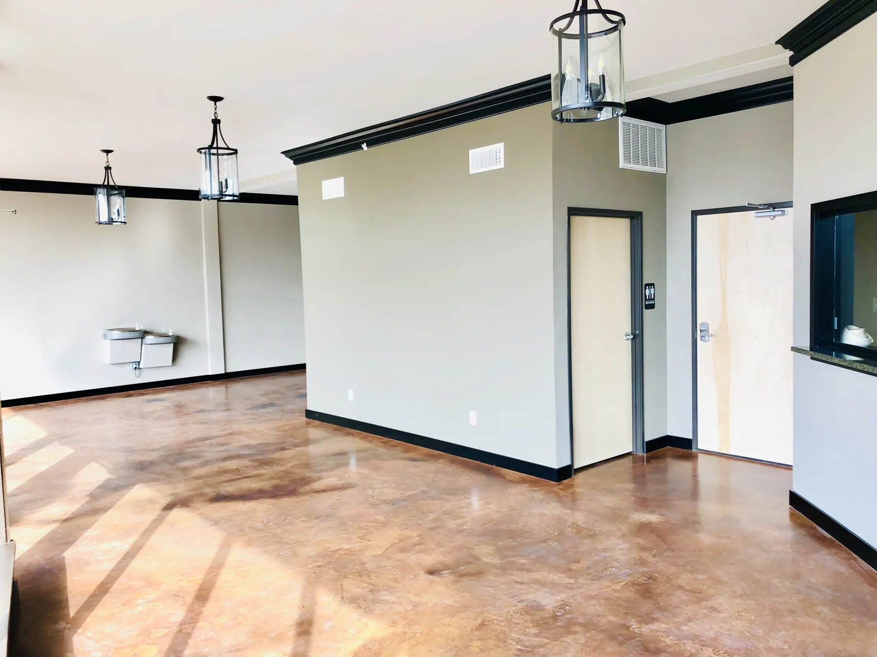 Office interior with stained concrete floors and new doors