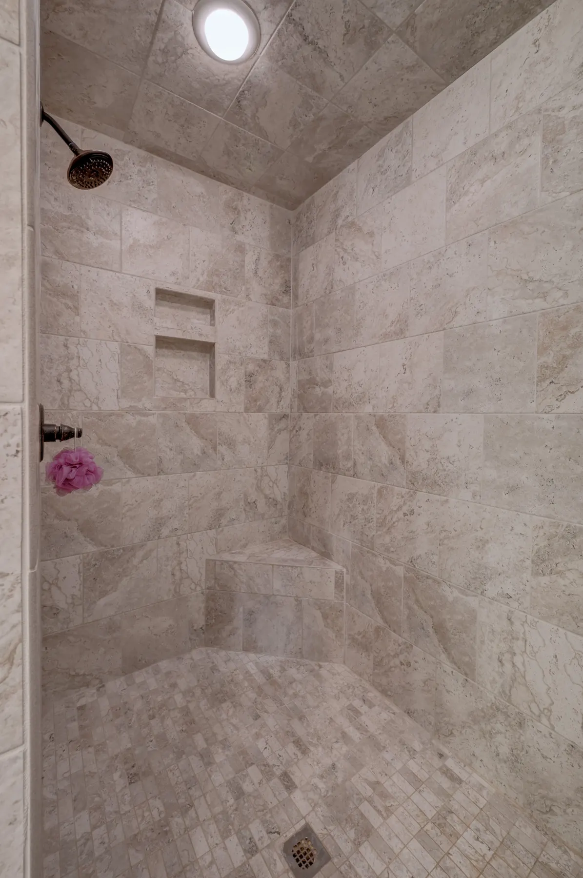 Walk-in tile shower with a niche