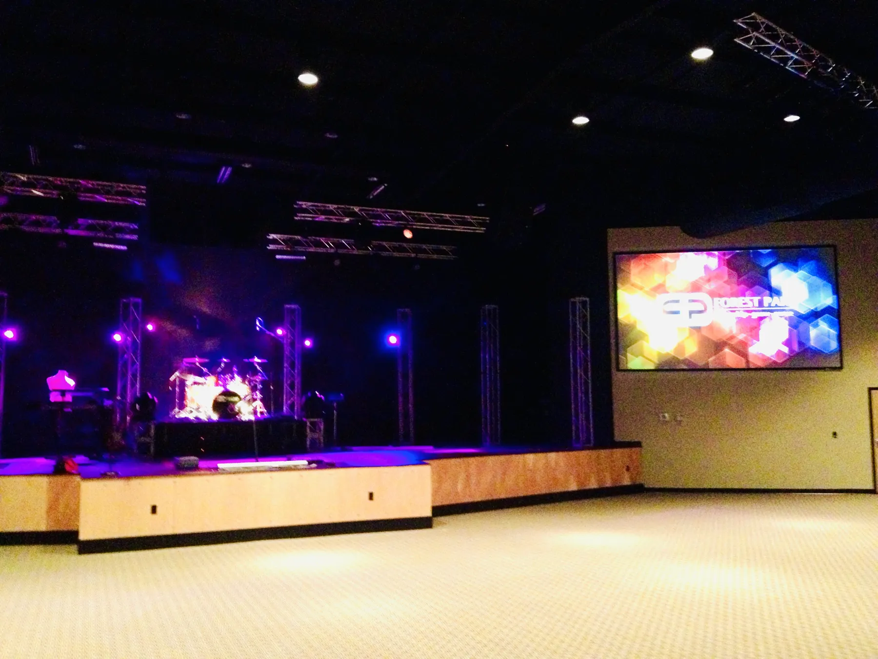 Wide view of a church stage and seating floor